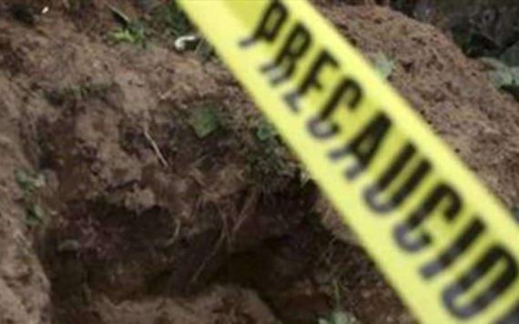 Hallan 18 cuerpos en fosa clandestina de Jalisco