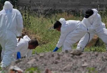 Encuentran 11 cuerpos en fosa clandestina en Michoacán