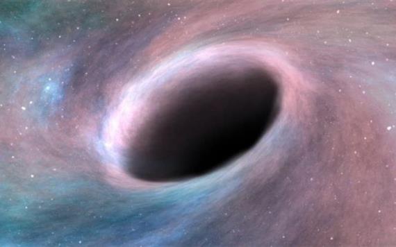 Descubren agujero negro supermasivo en galaxia vecina