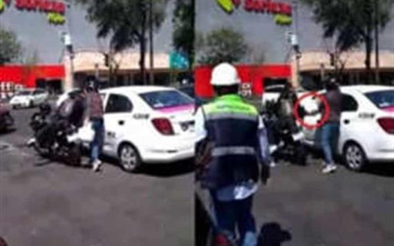 Mujer rompe cristal de taxi con un tanque de gas