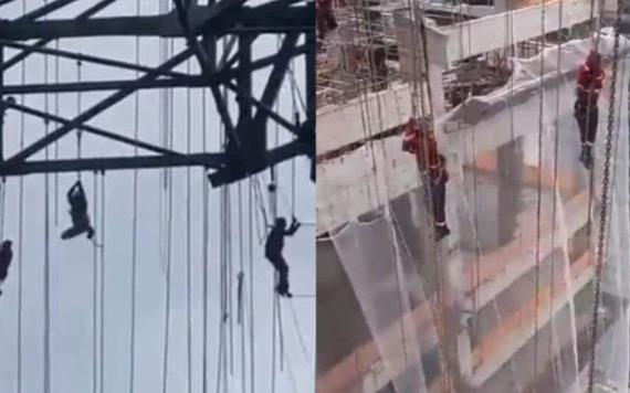Obreros quedaron colgados a 140 m de altura